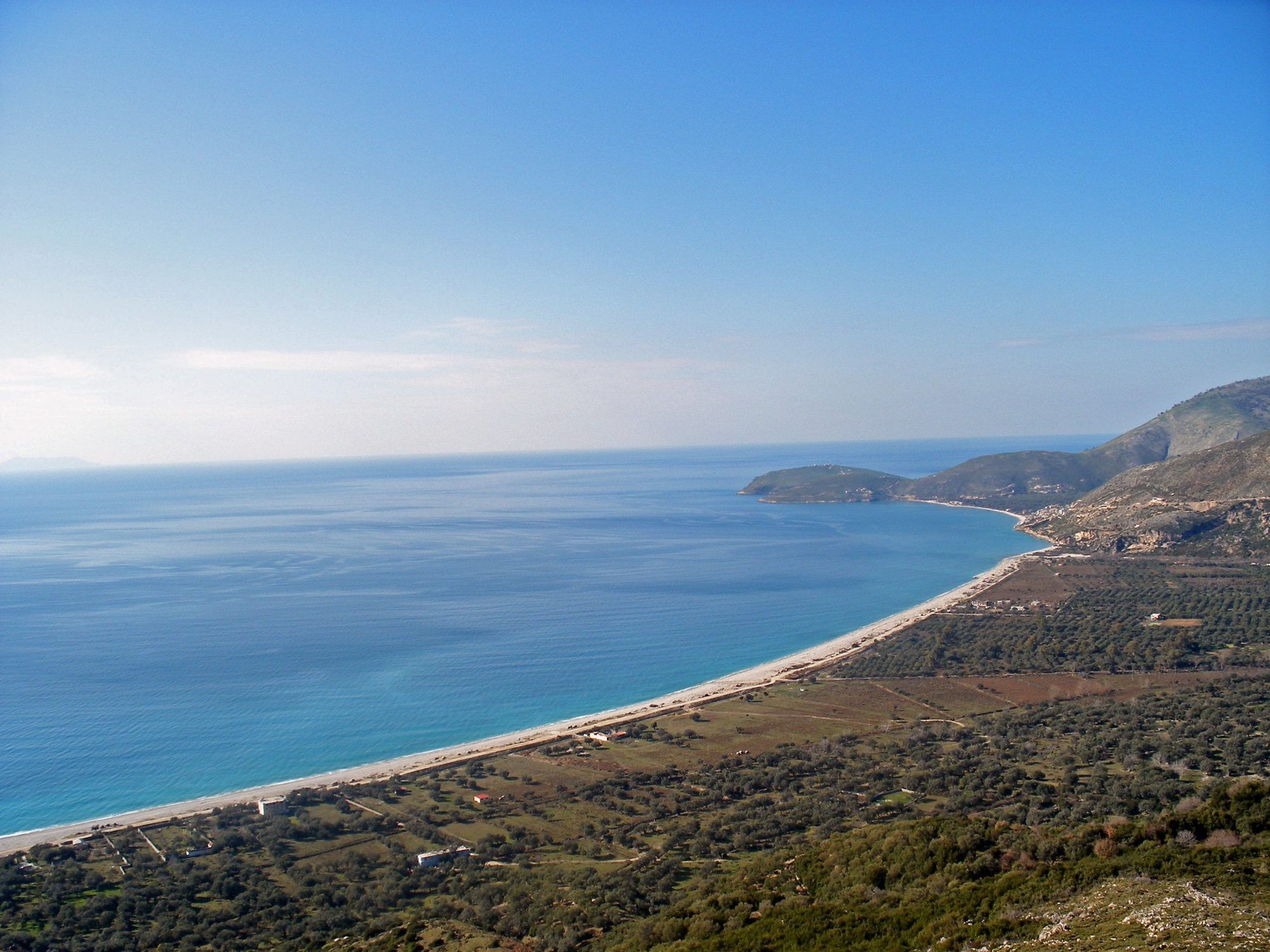 Borsh bay from the hills, with olive groves above the beach