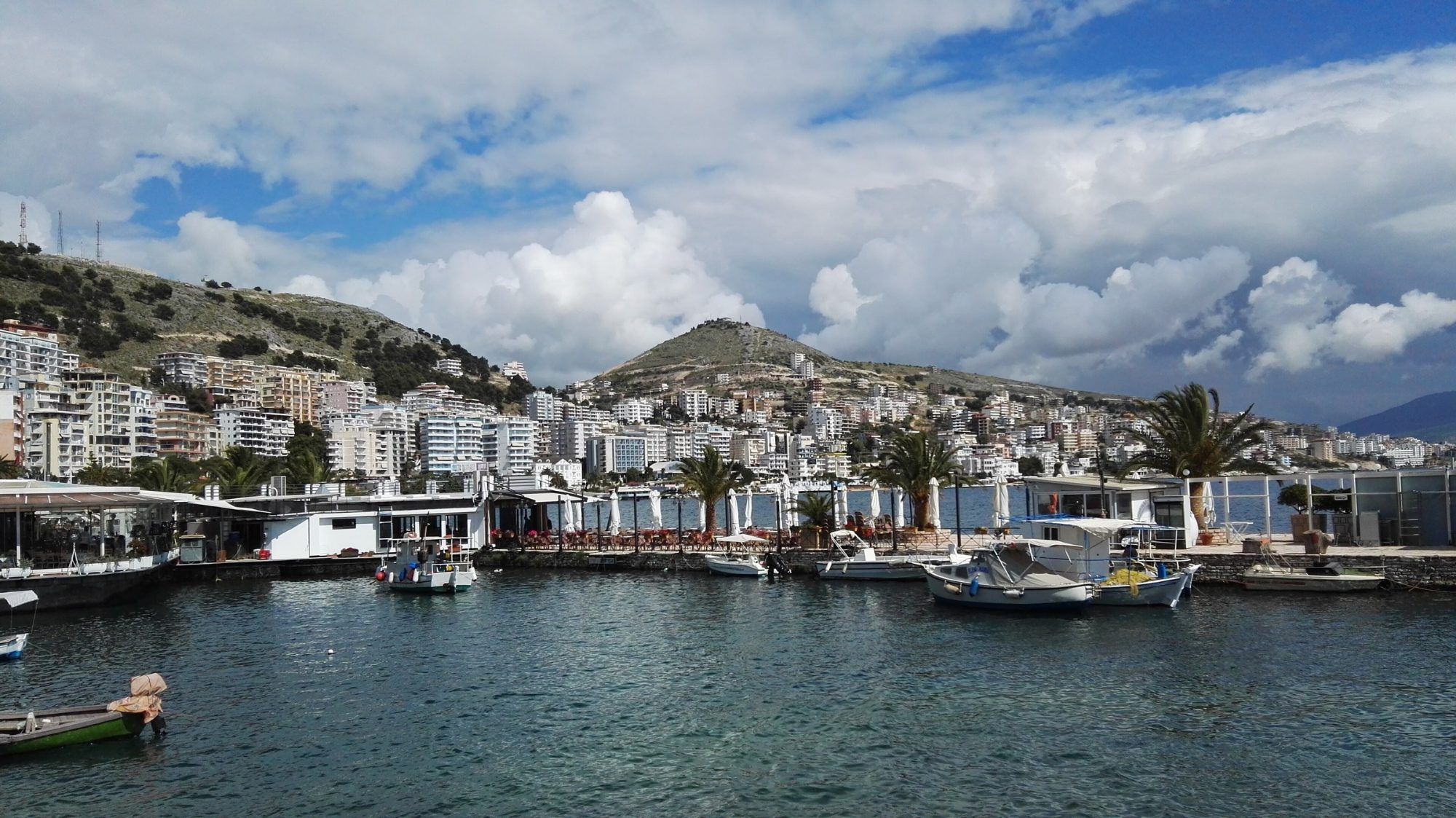Saranda harbour and the town on the hills